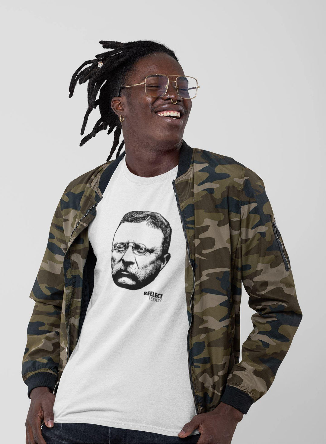 smiling Black man with hipster glasses wearing white reelect president Theodore Roosevelt unisex t-shirt